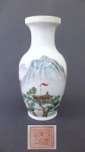 Polychrome vase with a house-landscape scene